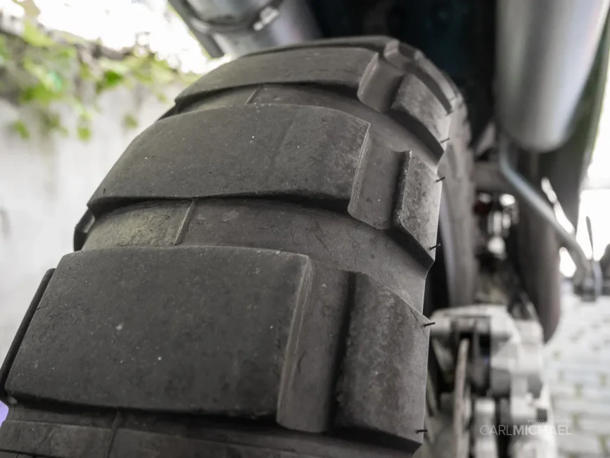 Shinko E805 rear tire, close up on tread. The tire is well worn after 9,000 miles of mixed terrain