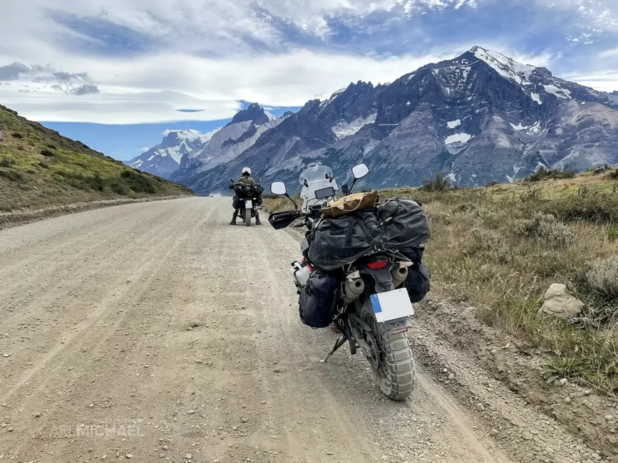 CM from defylife on motorcycle on dirt road in Torres del Paine, Chile. The bike had a Shinko e805 rear tire. Mountains can be seen in the background. 